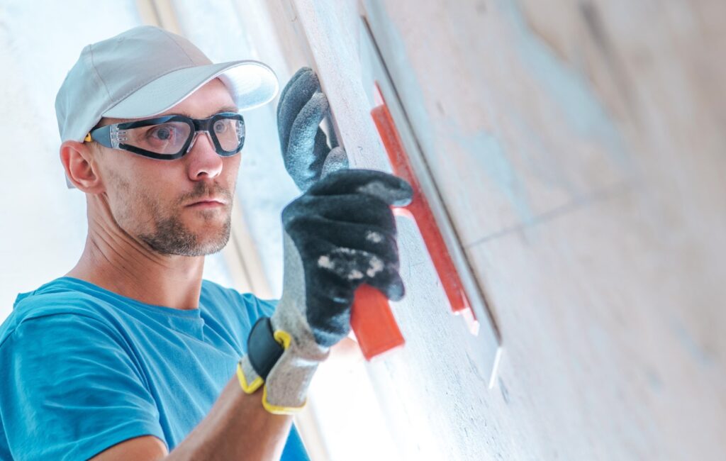 man finishing a wall, commercial painting 